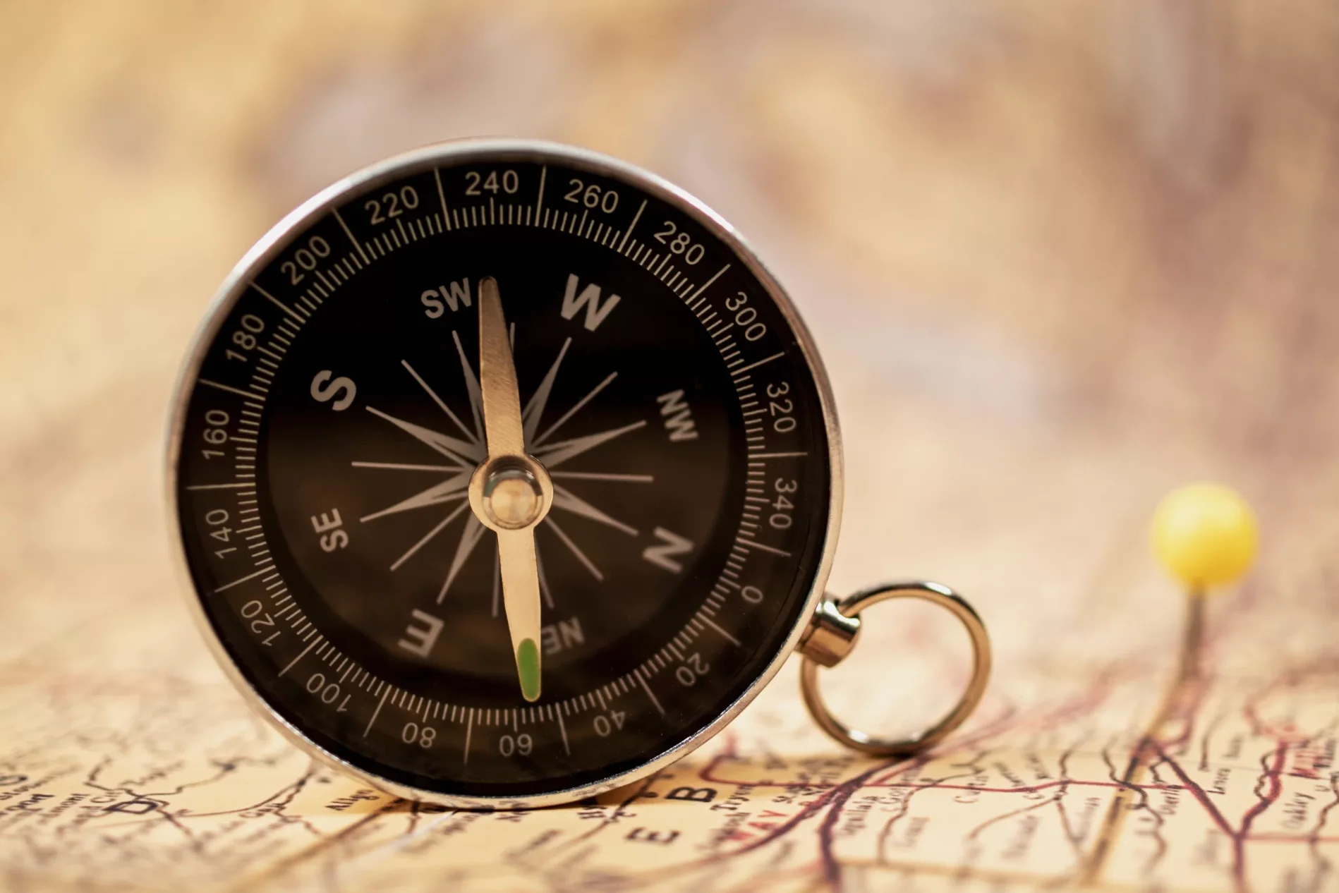 Compass on a map representing Vastu directions for a peaceful and prosperous home.